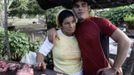 Luis Salgado (R), nicknamed Chucho, hugs his mother Niurka during a pig slaughter at their home in the village of Sagua La Grande in central Cuba, March 10, 2013. Chucho was granted a U.S. visa based on his father's status as legal resident in Texas, and he was reunited in Miami with his father, Jesus Salgado, who had escaped Cuba on a frail boat ten years earlier. The Salgados are among many Cubans taking advantage of Cuba's new travel policy in place since last January, which allows citizens to leave the country with just a passport and no need for much-hated exit visas required since 1961. Picture taken March 10, 2013. REUTERS/Desmond Boylan (CUBA - Tags: POLITICS SOCIETY) Published: Dub. 11, 2013, 1:07 odp.