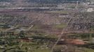 An aerial view of damage to neighborhoods in Moore, Oklahoma May 21, 2013, shows the path of destruction in the aftermath of a tornado which ravaged the suburb of Oklahoma City. Rescuers went building to building in search of victims and survivors picked through the rubble of their shattered homes on Tuesday, a day after a massive tornado tore through the Oklahoma City suburb of Moore, wiping out blocks of houses and killing at least 24 people. REUTERS/Rick Wilking (UNITED STATES - Tags: DISASTER ENVIRONMENT CITYSCAPE) Published: Kvě. 22, 2013, 3:04 dop.