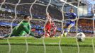 Chelsea's Eden Hazard (R) watches as Fernando Torres (not pictured) scores a goal past Atletico Madrid's goalkeeper Thibaut Courtois (L) during their Champion's League se