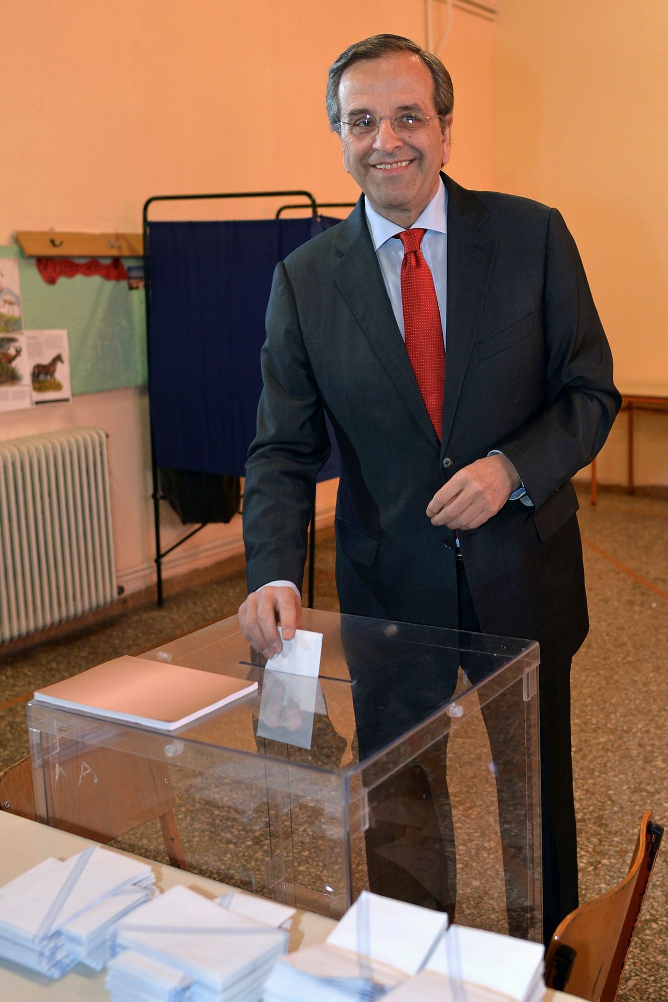 Greece's PM and leader of the conservative New Democracy party Samaras prepares to cast his ballot at a polling station in Pilos in southern Greece