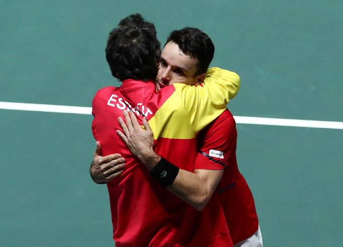 Tennis - Davis Cup Finals - Final - Caja Magica, Madrid, Spain - November 24, 2019   Spain's Roberto Bautista Agut celebrates with captain Sergi Bruguera after winning hi