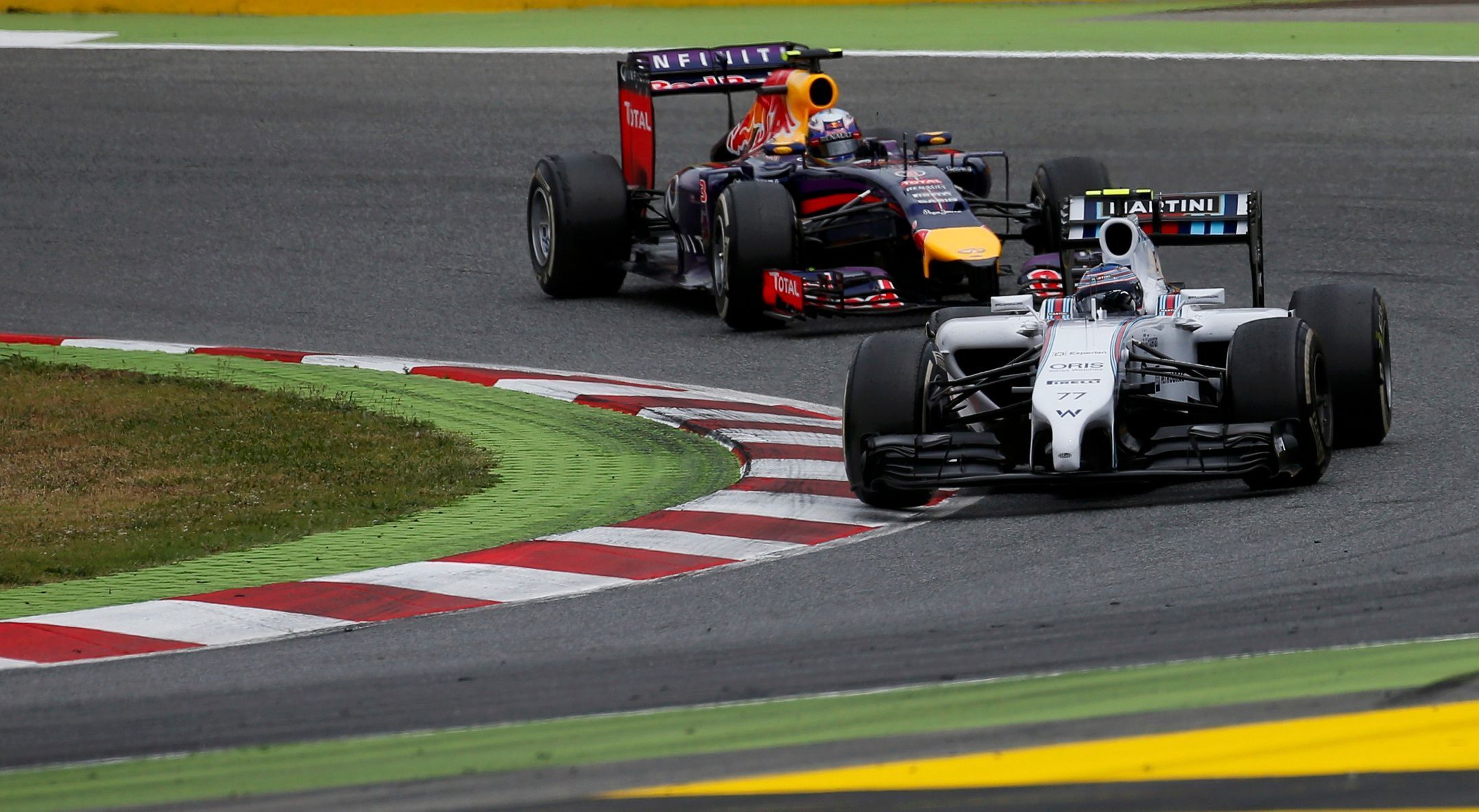 Williams Formula One driver Bottas of Finland and Red Bull Formula One driver Ricciardo of Australia compete during the Spanish F1 Grand Prix at the Barcelona-Catalunya Circuit in Montmelo