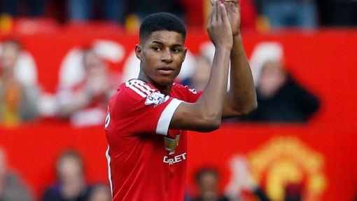 Manchester United's Marcus Rashford applauds their fans after the match