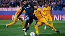 Atletico's Yannick Ferreira-Carrasco in action with Barcelona's Gerard Pique