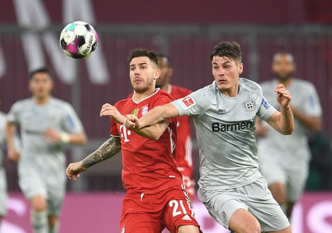 Soccer Football - Bundesliga - Bayern Munich v Bayer Leverkusen - Allianz Arena, Munich, Germany - April 20, 2021 Bayern Munich's Lucas Hernandez in action with Bayer Lev