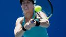 Eugenie Bouchard of Canada hits a return to Tang Haochen of China during their women's singles match at the Australian Open 2014 tennis tournament in Melbourne January 13