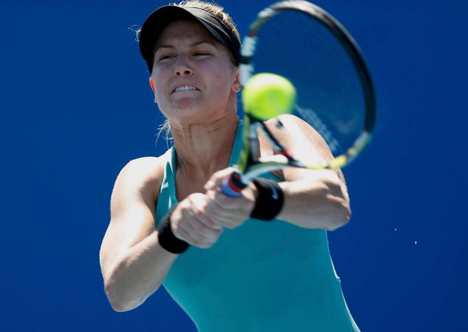 Eugenie Bouchard of Canada hits a return to Tang Haochen of China during their women's singles match at the Australian Open 2014 tennis tournament in Melbourne January 13