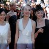 Director Naomi Kawase poses on the red carpet with cast members of her film &quot;Futatsume no mado&quot; (Still the Water) as they arrive at the closing ceremony of the 67th Cannes Film Festival