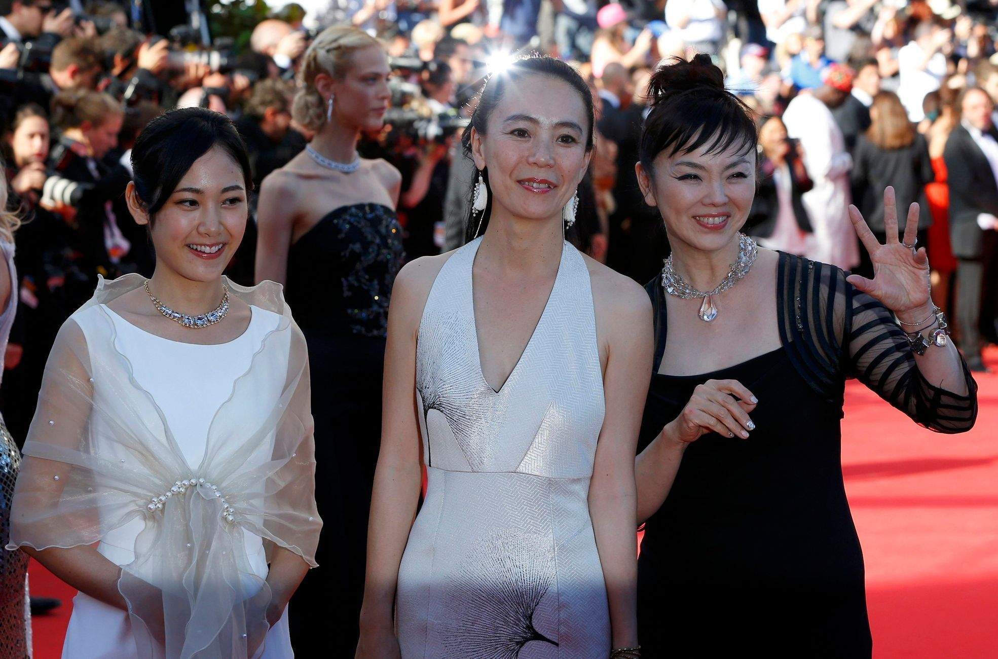 Director Naomi Kawase poses on the red carpet with cast members of her film &quot;Futatsume no mado&quot; (Still the Water) as they arrive at the closing ceremony of the 67th Cannes Film Festival
