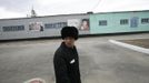 Inmate Boris Kovalyov, 32, walks at a high-security male prison camp outside Russia's Siberian city of Krasnoyarsk April 30, 2013. Kovalyov was sentenced to eight years in a high-security prison camp for drug trafficking, but was released two and a half years early, on May 10, 2013, for good behaviour and participation in sports and cultural activities. Before being released, Kovalyov had been serving part of his sentence in high-security male prison camp number 5, intended to house male inmates who have multiple convictions for serious crimes. Prisoners at the facility work in wood and metal processing shops, manufacture furniture, sew clothes and do other kinds of work. They can also take part in educational, sport and cultural programs. Picture taken April 30, 2013. REUTERS/Ilya Naymushin (RUSSIA - Tags: CRIME LAW SOCIETY) ATTENTION EDITORS: PICTURE 24 OF 29 FOR PACKAGE 'INSIDE SIBERIA'S PRISONS' SEARCH 'ILYA PRISON' FOR ALL IMAGES Published: Čer. 19, 2013, 10:05 dop.