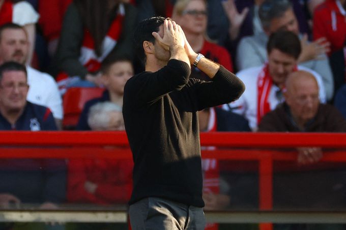 Arsenal manager Mikel Arteta with his head in his hands after the defeat in Nottingham