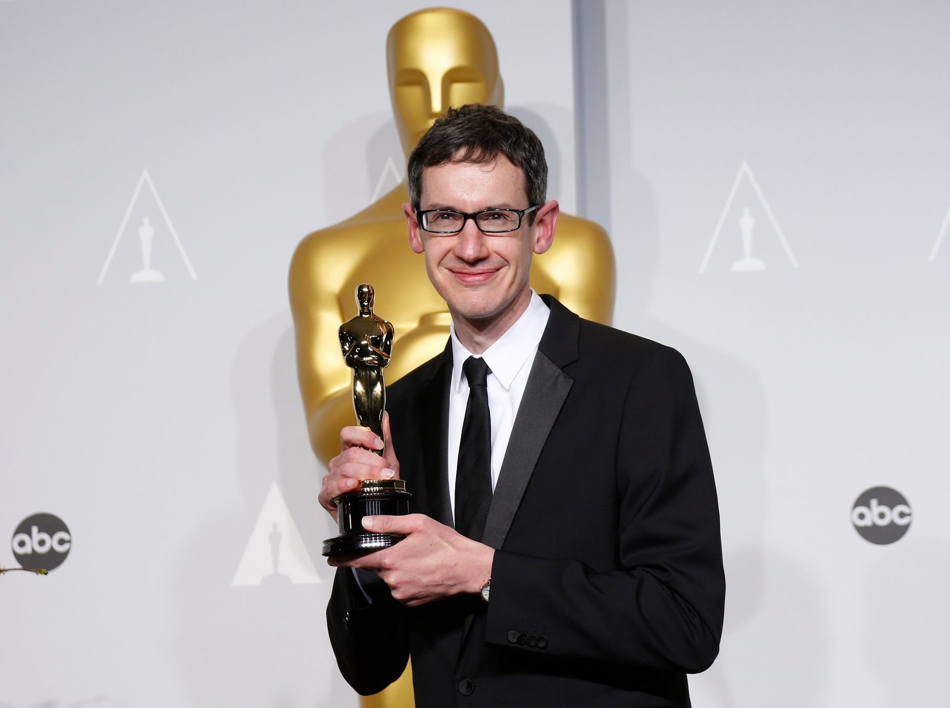 Price holds his Oscar for best original score for the film &quot;Gravity&quot; at the 86th Academy Awards in Hollywood