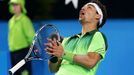 Fabio Fognini of Italy reacts to a shot from John Isner of the U.S. during their men's singles tennis match at the 2015 Hopman Cup in Perth