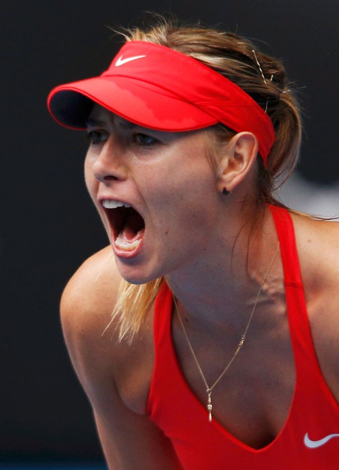 Maria Sharapova of Russia reacts after winning a point against Eugenie Bouchard of Canada during their women's singles quarter-final match at the Australian Open 2015 ten