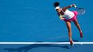 Casey Dellacqua of Australia serves to Kirsten Flipkens of Belgium during their women's singles match at the Australian Open 2014 tennis tournament in Melbourne January 1