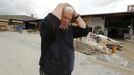 Wood mercantilist Walter Hundshammer, 73, reacts as he walks over his devastated firm founded by his grandfather in 1909 in Natternberg, a suburb of the eastern Bavarian city of Deggendorf June 10, 2013. Hundshammer said that he estimates the damage over one million Euros after the floods of the nearby Danube river subsided. REUTERS/Wolfgang Rattay (GERMANY - Tags: DISASTER ENVIRONMENT)