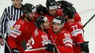 Switzerland's Damien Brunner (front, L) celebrates his goal against Germany with team mate Constantin Braun (front, R) during the first period of their men's ice hockey W