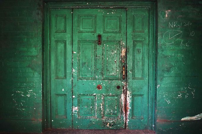 Ground floor doorway of former British colonial administration building is marked by age in Hill Station of Freetown