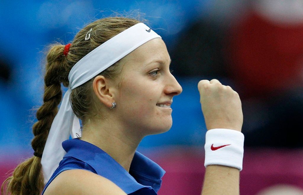 Česká tenistka Petra Kvitová slaví vítězství ve finále Fed Cupu 2011 proti Rusku.