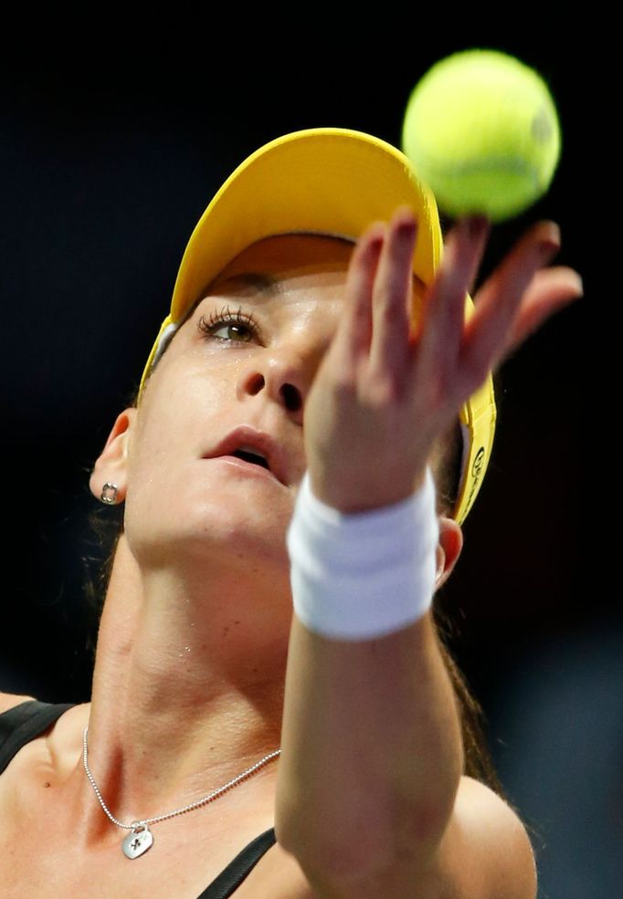 Agnieszka Radwanska of Poland prepares to serve to Caroline Wozniacki of Denmark during their WTA Finals singles tennis match at the Singapore Indoor Stadium October 23,