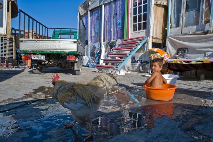 3 Titulek: Gypsy slums of Greece Popis: September 16, 2011, Tavros, Athens/Attica, Greece: Almost 30,000 Gypsies or "Roma" from Albania and Bulgaria enter Greece in the last two years. Since 1998, one thousand Roma have lived in a slum in the Votanicos area, of the Tavros municipality of Athens. Their 600 children aged from infants to 15 years old, live under unhealthy conditions in the garbage strewn township where the Roma survive by stealing or collecting metal garbage to sell. The Roma burn cables to extract the copper inside, which creates a toxic cloud from cancerous dioxines that hangs over their shantytown. While shantytowns are less common in Europe, the growing influx of illegal immigrants have fueled shantytowns in cities commonly used as a points of entry into the EU, including Athens. In October 2013, an unidentified girl, called "Maria," was found in a Greek gypsy camp and could be related to missing child cases. Over 8,000 calls about the girl from all over the world including the U.S. and Canada have been received inquiring about the child. The blond girl, approximately age 4, was found in a Roma gypsy settlement in central Greece. DNA tests proved that she was not related to the 39-year-old man and 40-year-old woman who claimed to be her parents.