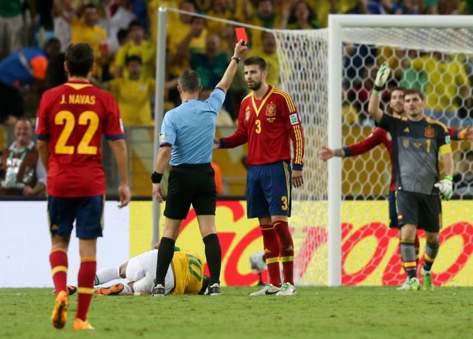 Referee Bjorn Kuipers of the Netherlands (2nd L) shows Spain's Gerard Pique (3) the red card after he fouled Brazil's Neymar (bottom) during their Confederations Cup fina