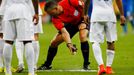 Referee Bjorn Kuipers of the Netherlands (C) marks out a line with an invisible spray during the 2014 World Cup Group D soccer match between England and Italy at the Amaz