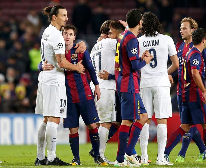 Paris St Germain's Zlatan Ibrahimovic embraces Barcelona's Lionel Messi after their Champions League Group F soccer match at the Nou Camp stadium in Barcelona