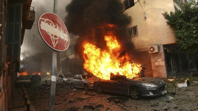 Burning cars and damages are seen at the site of an explosion in Ashafriyeh, central Beirut, October 19, 2012. A huge car bomb exploded in a street in central Beirut duri
