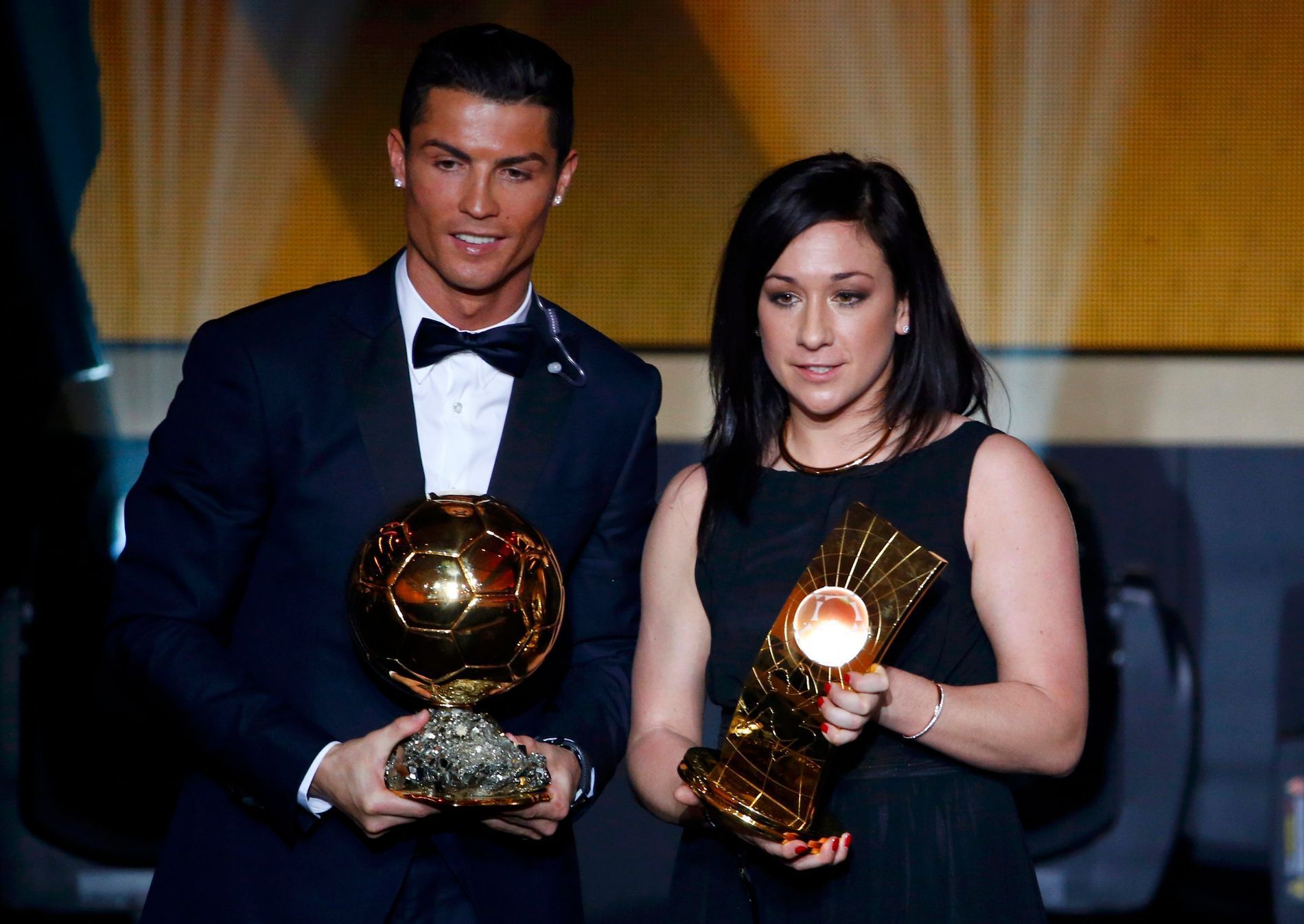 Winner of FIFA Ballon d'Or award, Real Madrid and Portugal forward Ronaldo poses with winner of the FIFA Women's World Player of the Year Kessler of Germany during the FIFA Ballon d'Or 2014 soccer awa