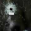 A bullet impact is seen in the window near the Le Carillon restaurant, one of the attack sites in Paris