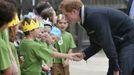 Britain's Prince Harry greets school children during his visit to Halfmoon Bay school on Stewart Island in southern New Zealand