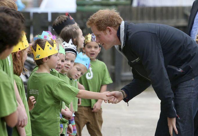 Britain's Prince Harry greets school children during his visit to Halfmoon Bay school on Stewart Island in southern New Zealand