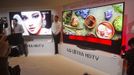 Journalists get an early look at a curved OLED Ultra HD television by LG Electronics during the 2014 Consumer Electronics Show (CES) in Las Vegas, Nevada, January 6, 2014