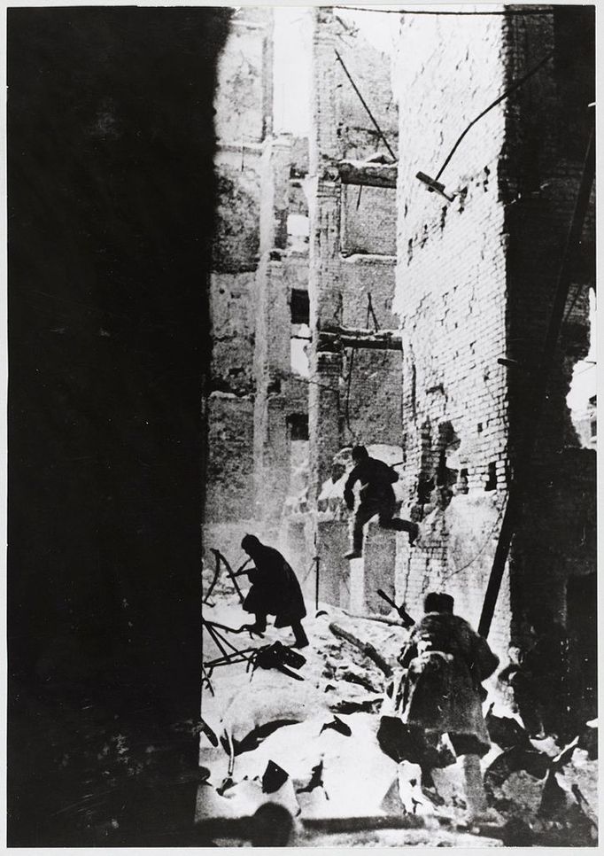 STALINGRAD - STREET FT. Through the windowless side of a ruined building, a photographer records the horrific street fighting which proceeded, literally, from one buildi Date: Source: Photograph by Georgi Zelina MELEDIN COLLECTION