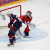 Russia's goalie Bobrovski makes a save on a breakaway by Team USA's Kane during overtime in their men's preliminary round ice hockey game at the 2014 Sochi Winter Olympic Games