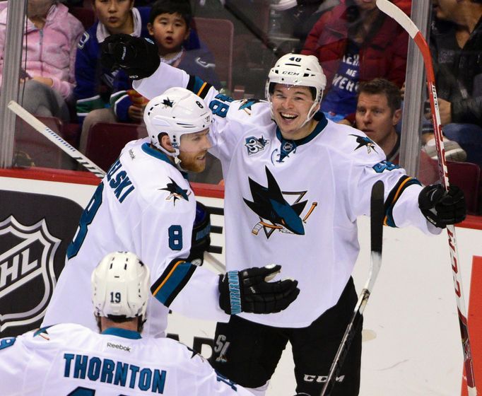 San Jose Sharks forward Tomas Hertl (48) celebrates his goal against Vancouver Canucks goaltender Ryan Miller (not pictured) with forward Joe Pavelski (8) and forward Joe