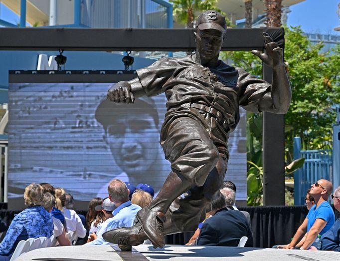 Jun 18, 2022; Los Angeles, CA, USA;  A video montage of the career of Sandy Koufax is shown on a screen behind the Jackie Robinson statue during an unveiling ceremony for