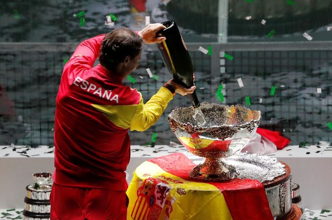 Tennis - Davis Cup Finals - Final - Caja Magica, Madrid, Spain - November 24, 2019   Spain's Rafael Nadal pours champagne in to the trophy after winning the Davis Cup fin