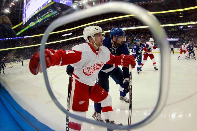 Apr 29, 2015; Tampa, FL, USA; Tampa Bay Lightning center Alex Killorn (17) defends Detroit Red Wings right wing Luke Glendening (41) during the second period of the first