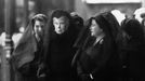 File photo dated 12/02/1952 of Queen Mary (centre) watching as the body of her son, George VI, is brought to Westminster Hall, London, for the lying-in-state. By her side