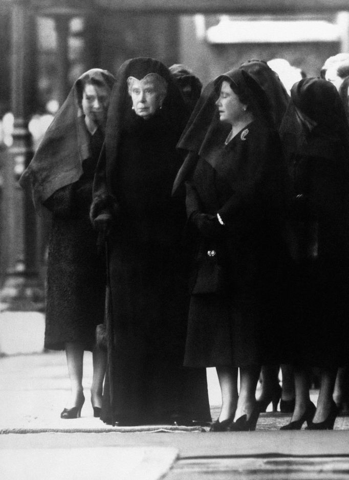 File photo dated 12/02/1952 of Queen Mary (centre) watching as the body of her son, George VI, is brought to Westminster Hall, London, for the lying-in-state. By her side