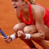 Eugenie Bouchard of Canada reacts after winning her women's quarter-final match against Carla Suarez Navarro of Spain at the French Open Tennis tournament at the Roland Garros stadium in Paris