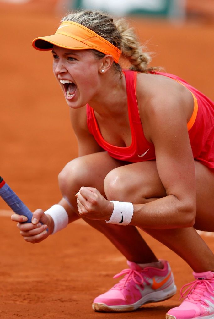 Eugenie Bouchard of Canada reacts after winning her women's quarter-final match against Carla Suarez Navarro of Spain at the French Open Tennis tournament at the Roland G