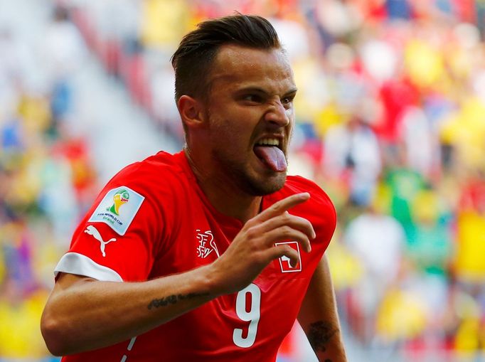 Switzerland's Haris Seferovic celebrates after scoring a goal to defeat Ecuador in their 2014 World Cup Group E soccer match at the Brasilia national stadium in Brasilia,