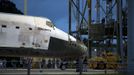 The space shuttle Discovery is being towed for the last time out of the Vehicle Assembly Building to the Mate Demate Facility at Kennedy Space Center