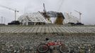 The Olympic stadium for the Sochi 2014 Winter Olympics is seen under construction at the seafront, within the perimeter of the Olympic Park in Adler, near Sochi February 18, 2013. Although many complexes and venues in the Black Sea resort of Sochi mostly resemble building sites that are still under construction, there is nothing to suggest any concern over readiness. Construction will be completed by August 2013 according to organizers. The Sochi 2014 Winter Olympics opens on February 7, 2014. REUTERS/Kai Pfaffenbach (RUSSIA - Tags: BUSINESS CONSTRUCTION ENVIRONMENT SPORT OLYMPICS) Published: Úno. 18, 2013, 6:01 odp.