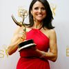 Julia Louis-Dreyfus poses with her award at the 66th Primetime Emmy Awards in Los Angeles
