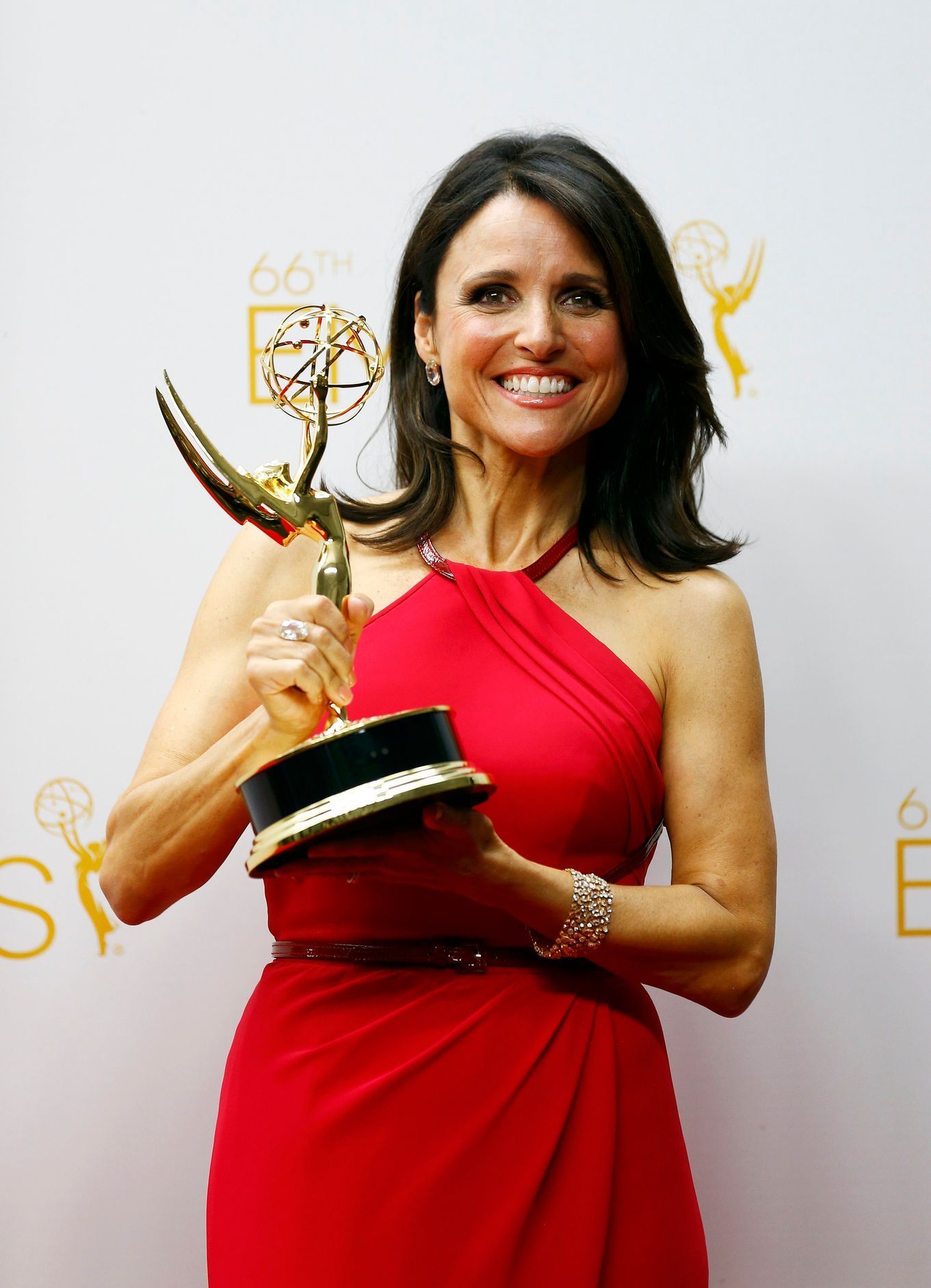 Julia Louis-Dreyfus poses with her award at the 66th Primetime Emmy Awards in Los Angeles