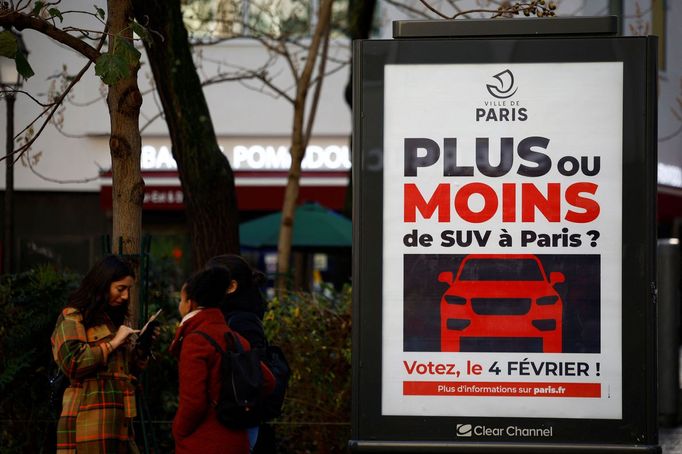 FILE PHOTO: A poster reading "More or less SUV cars in Paris ? Vote on February 4, 2024" is seen on a billboard in a street in Paris, France, November 17, 2023.  REUTERS/